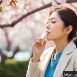 스트레스 해소 방법 - A serene Japanese woman in modern casual attire practicing deep breathing exercises outdoors during ...